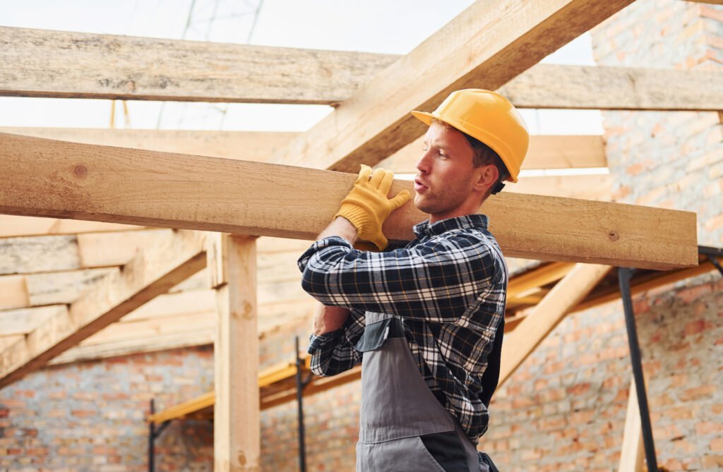 Carpenter Transporting wooden boards